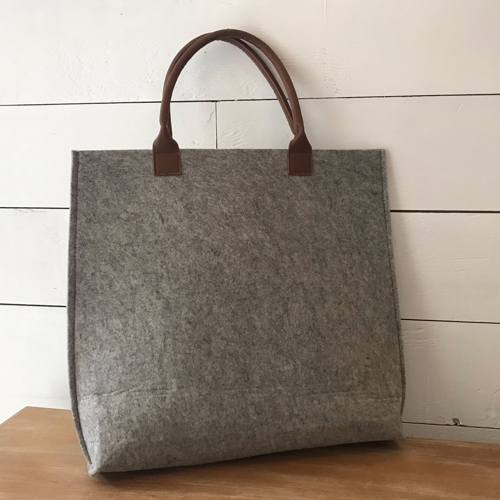 Gray felt tote bag with brown handles
